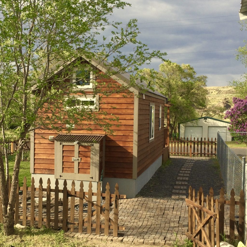 The Nostalgia Cottage Back View With Utility Shed 